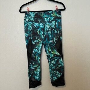 Athleta size small crop legging with mesh detailing and tropical teal print.